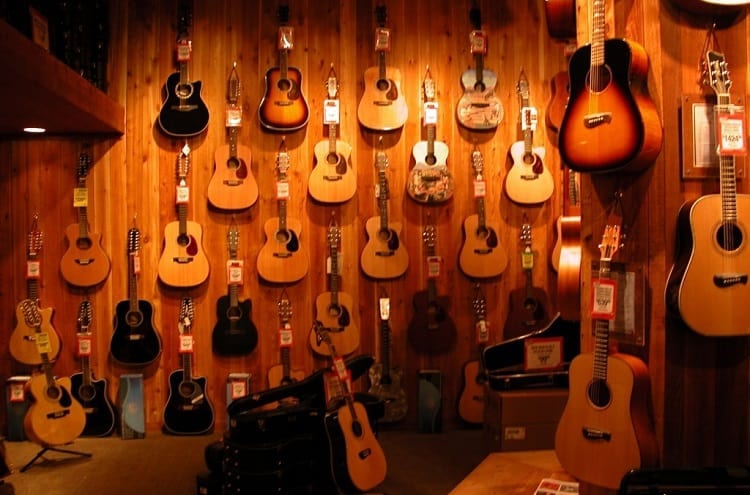 wall of guitars in music shop