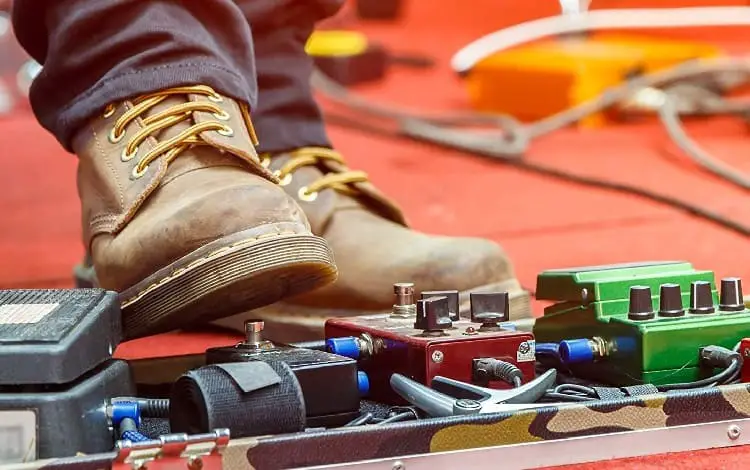 foot on a fuzz pedal